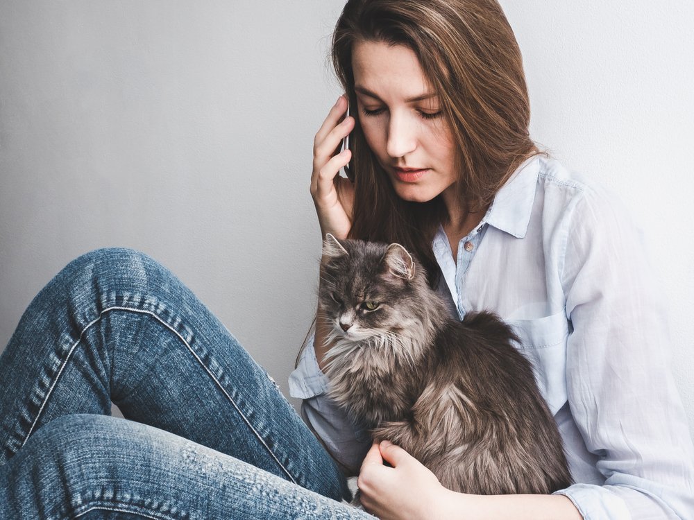 Woman who calls her phone with her cat