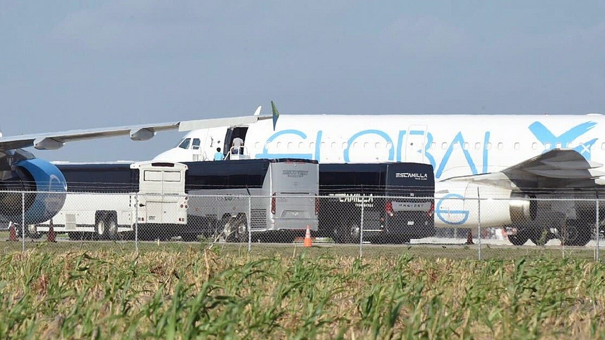 Charter buses of Guatemalan repatriations at asphalt at Texas Airport